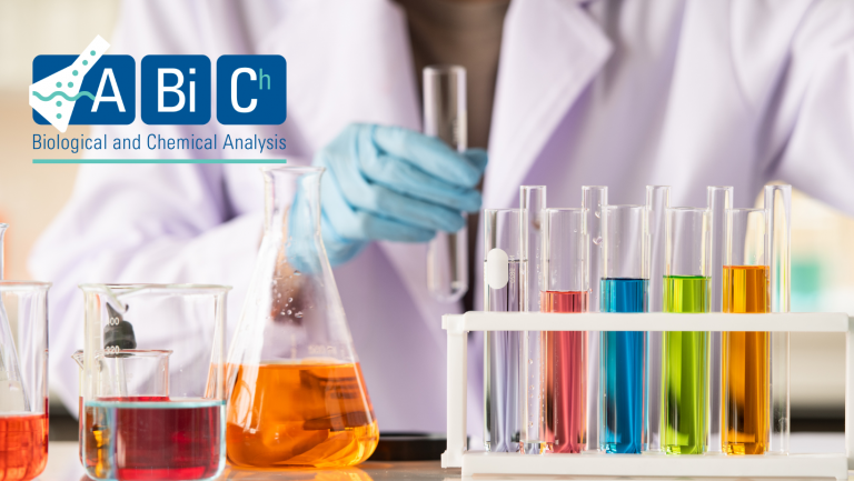 Scientist with test tubes and colorful liquids in lab.